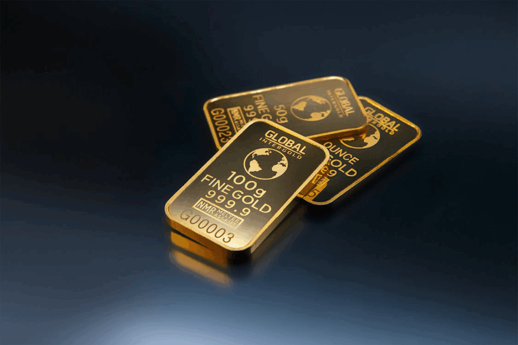 Three gold bars on a dark background